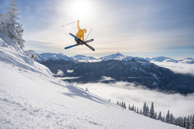 Skier Does Mute Jump Trick with a Scenic Background at Whistler Blackcomb