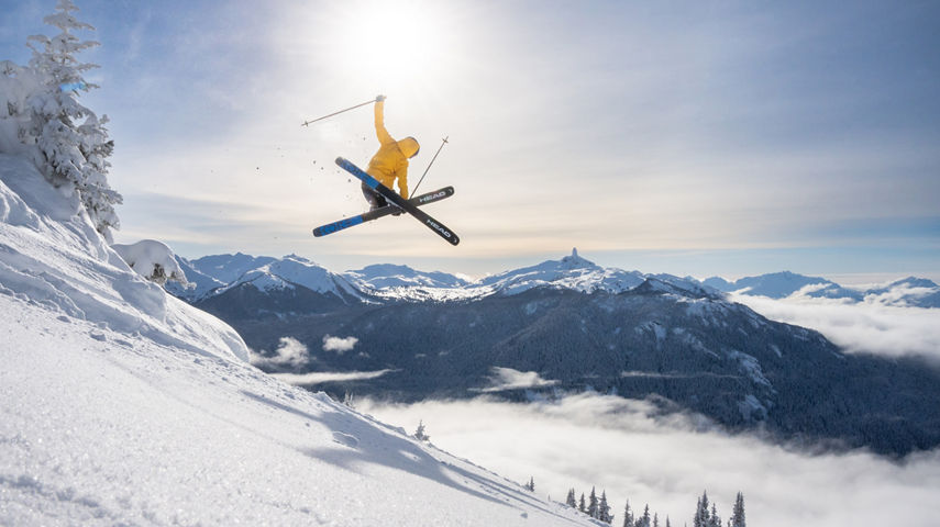 Skier Does Mute Jump Trick with a Scenic Background at Whistler Blackcomb
