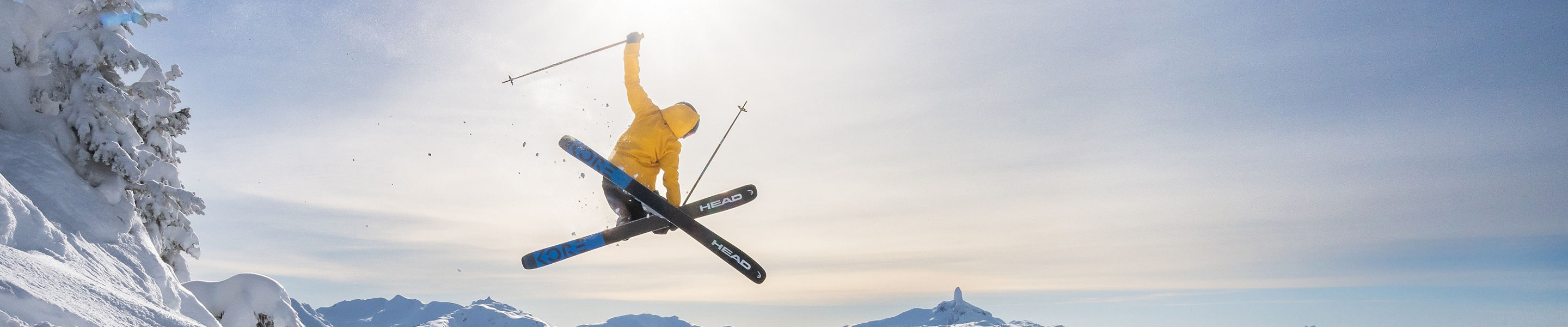 Skier Does Mute Jump Trick with a Scenic Background at Whistler Blackcomb