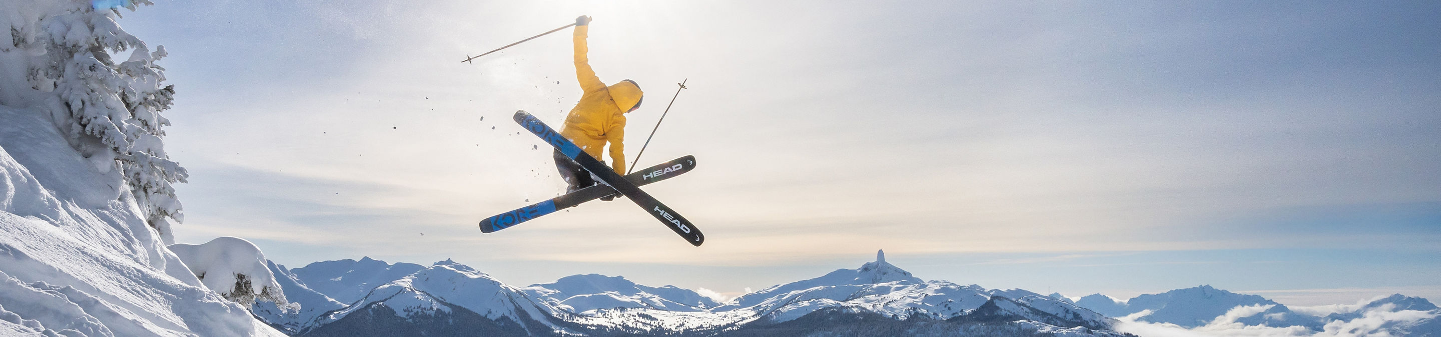 Skier Does Mute Jump Trick with a Scenic Background at Whistler Blackcomb