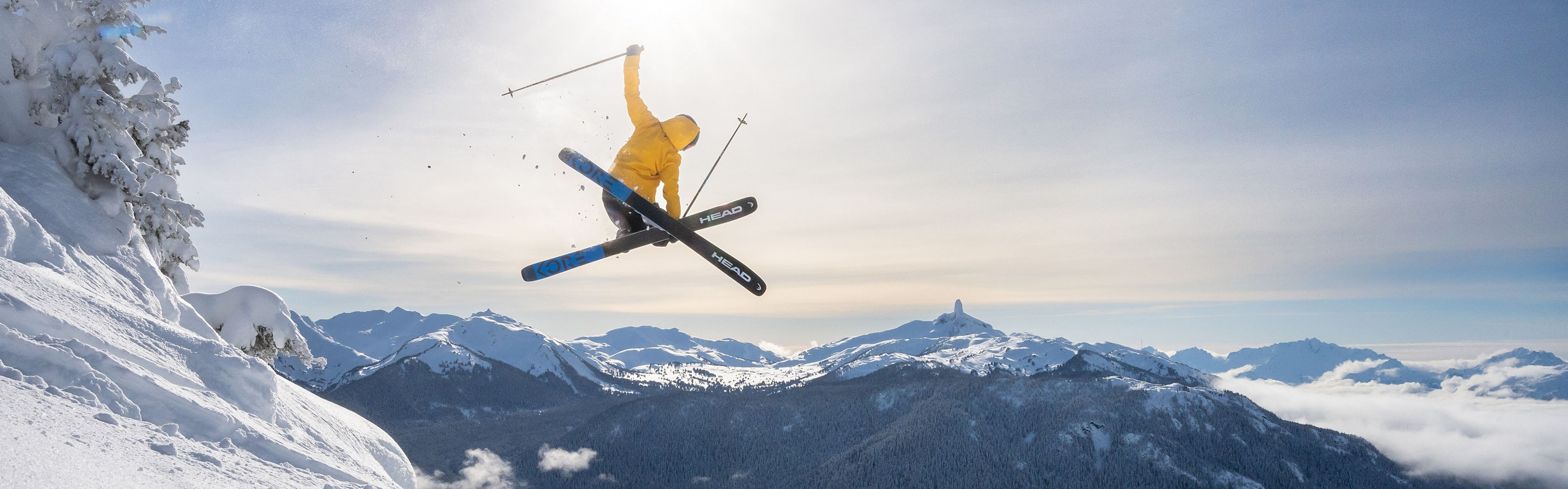 Skier Does Mute Jump Trick with a Scenic Background at Whistler Blackcomb