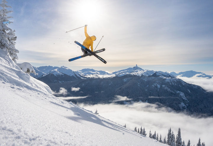 Skier Does Mute Jump Trick with a Scenic Background at Whistler Blackcomb