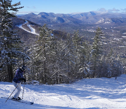 Skier Hitting Tree-Lined Run at Attitash