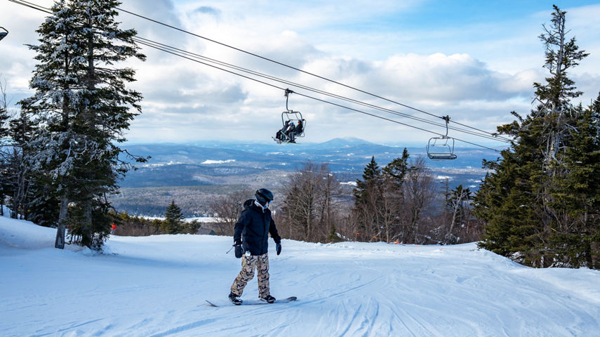 Snowboarder Descends Mountain at Mount Sunapee