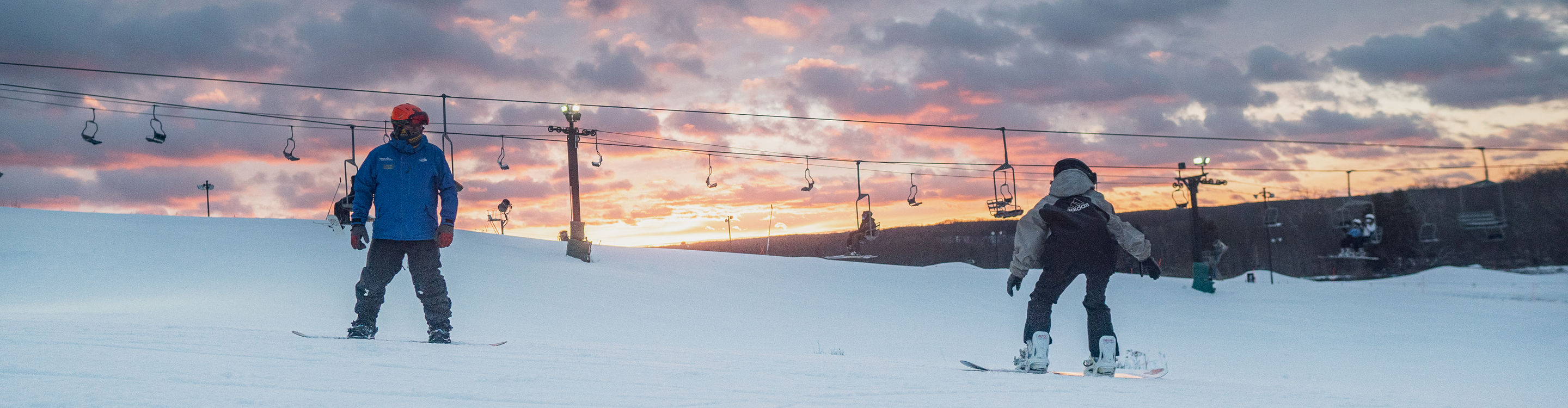 Snowboarders Descend Mountain at Boston Mills Brandywine