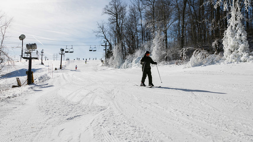 Resort Guests Skis Down Mountain at Paoli Peaks