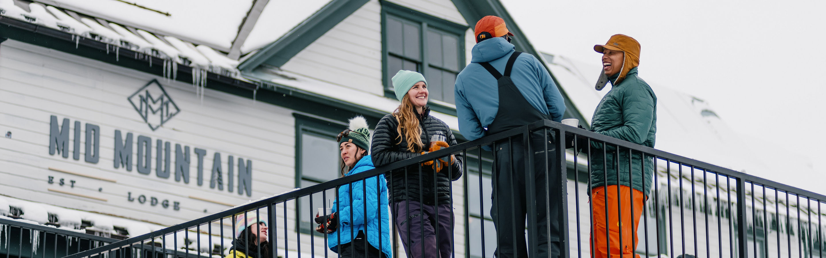 Group of Friends Enjoying Apres on the Balcony of Mid Mountain at Park City