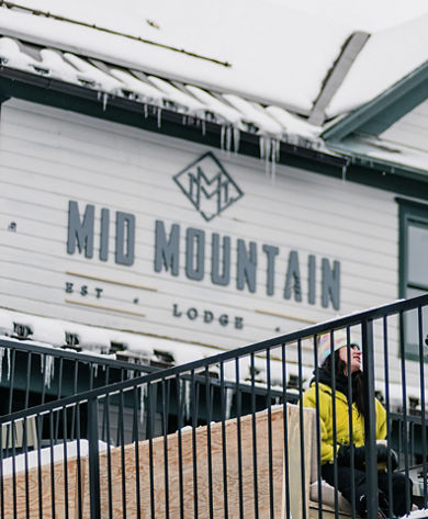 Group of Friends Enjoying Apres on the Balcony of Mid Mountain at Park City