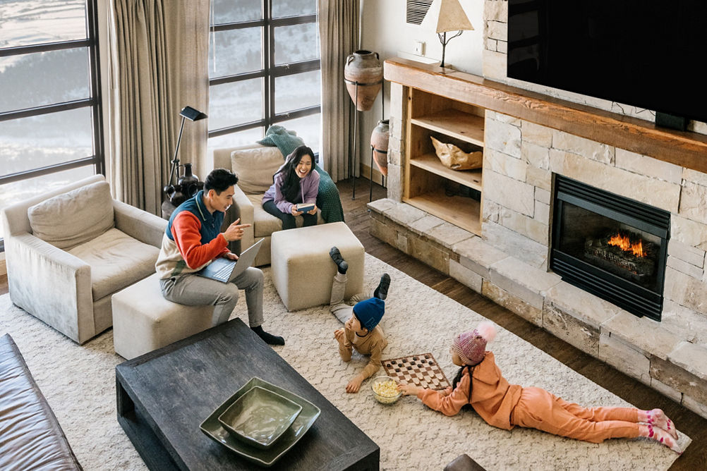 Family Enjoys Leisure Time Playing Boardgames in Their Unit at Grand Summit Lodging at Park City