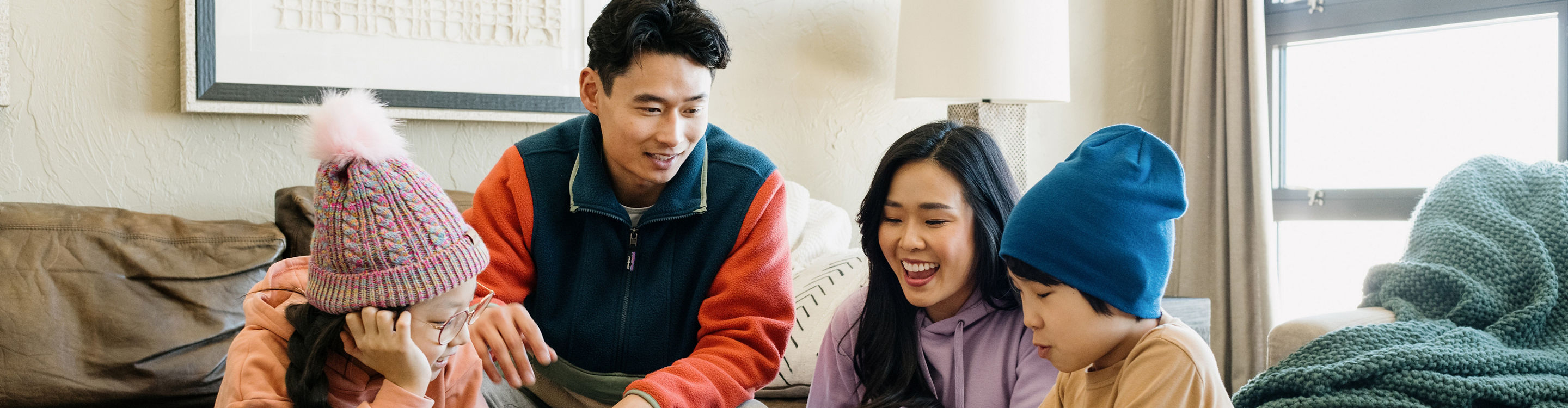 Family Enjoys Leisure Time Playing Boardgames in Their Unit at Grand Summit Lodging at Park City