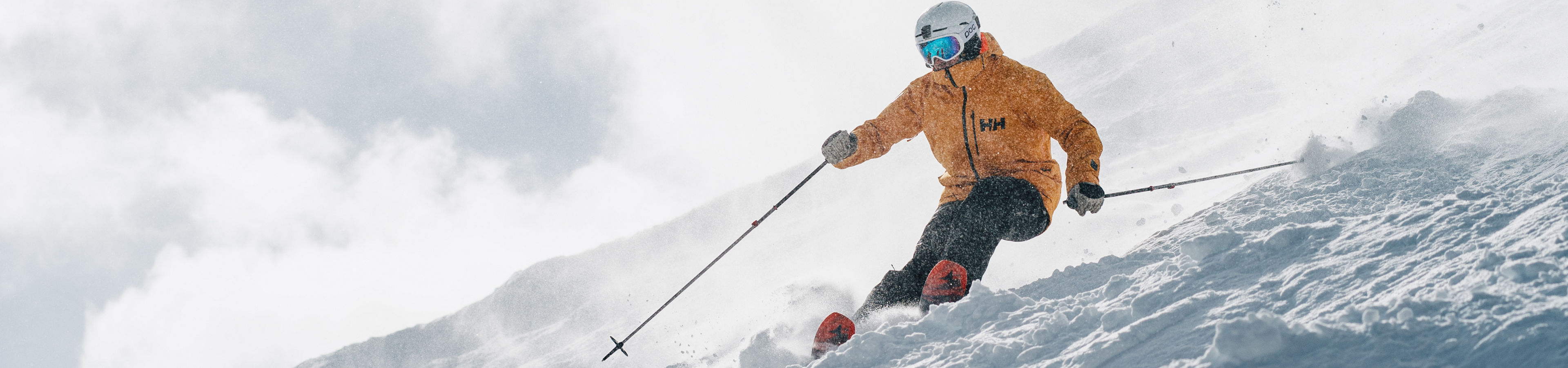 Skier in Yellow Jacket Skis Down Advanced Terrain at Park City