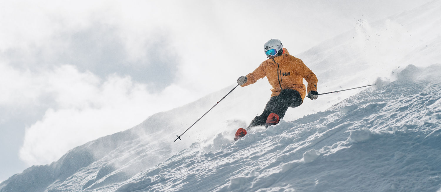 Skier in Yellow Jacket Skis Down Advanced Terrain at Park City