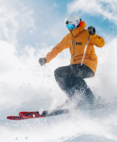 Skier in Yellow Jacket Skis Down Advanced Terrain at Park City