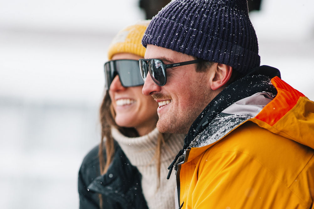 Woman and Man Enjoy Drinking a Beer During Apres at Park City