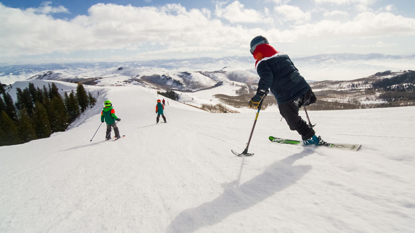 Adaptive Skier Skis with Children at Park City