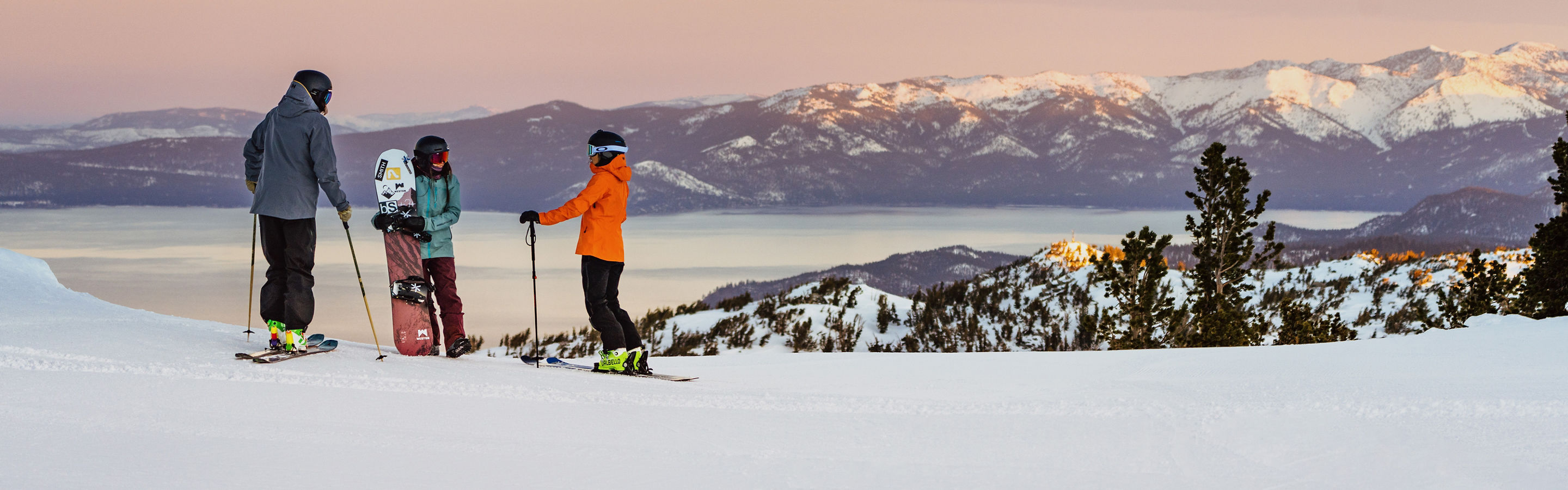 Resort Guests Stand at the Top of a Run as the Sun Rises at Heavenly