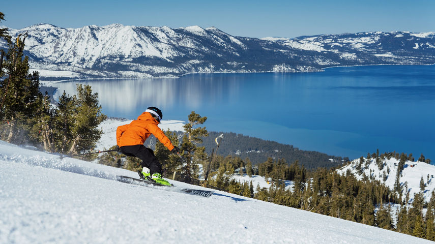 Skier Hits a Run at Heavenly with a Scenic View of Lake Tahoe in the Background