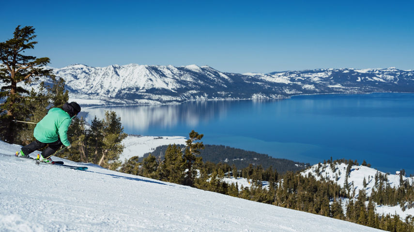 Skier Hits a Run at Heavenly with a Scenic View of Lake Tahoe in the Background