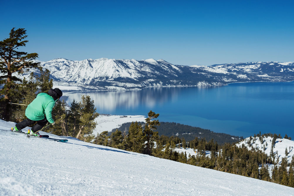 Skier Hits a Run at Heavenly with a Scenic View of Lake Tahoe in the Background