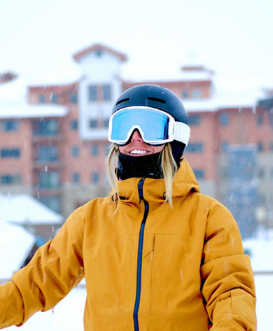 Woman Smiling While Skiing at Crested Butte