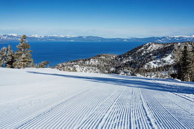 Scenic View of Groomed Trail at Heavenly with a View of Lake Tahoe in the Background