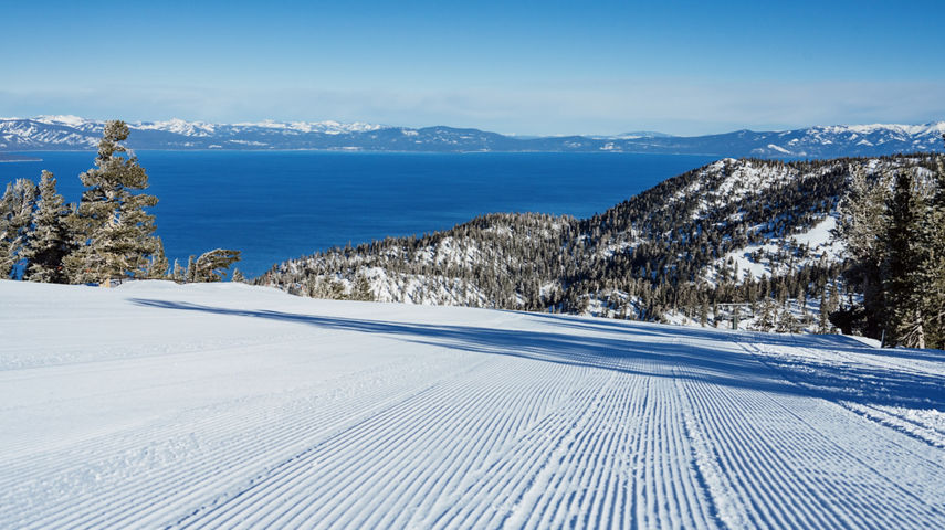 Scenic View of Groomed Trail at Heavenly with a View of Lake Tahoe in the Background