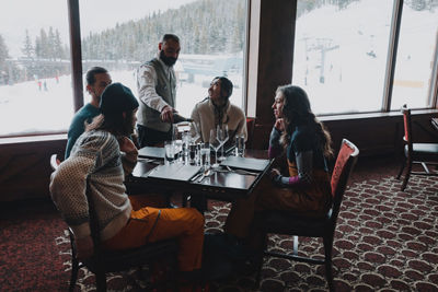 Friends Being Served Wine at Vail