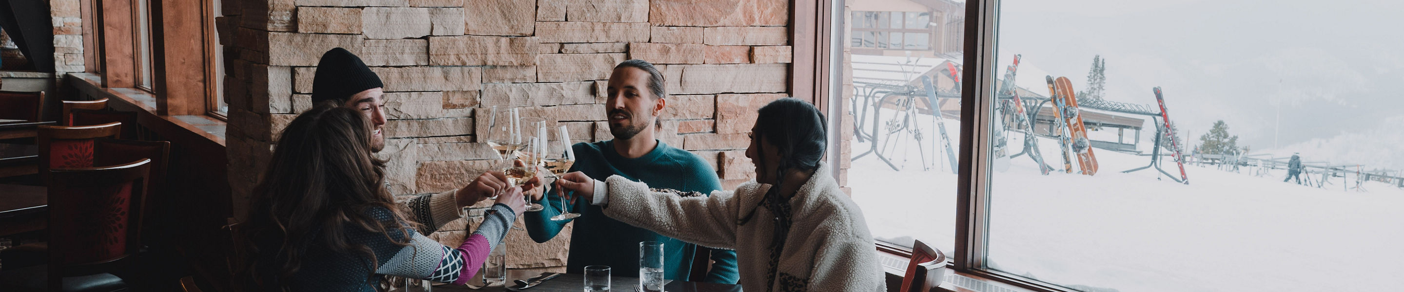Friends Clinking Wine Glasses During Lunch at Vail