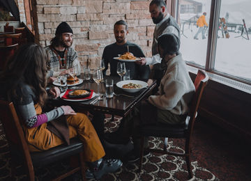 Friends Being Served Lunch at Vail