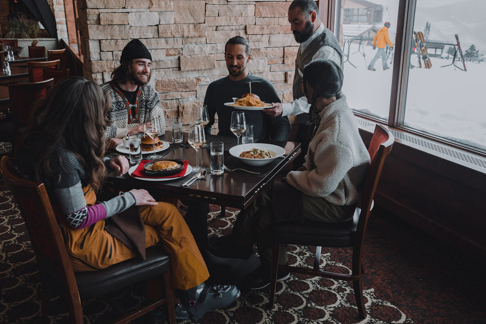 Friends Being Served Lunch at Vail