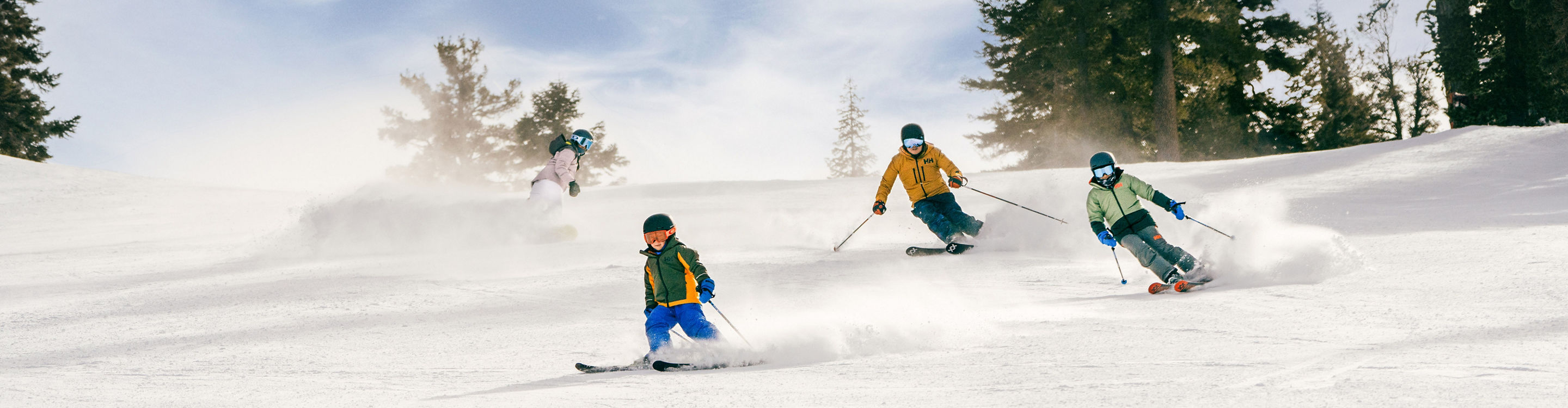 Family Enjoys Skiing Down a Trail at Northstar