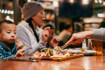 Family Enjoys Eating Appetizers at Wild Pine Restaurant at Northstar
