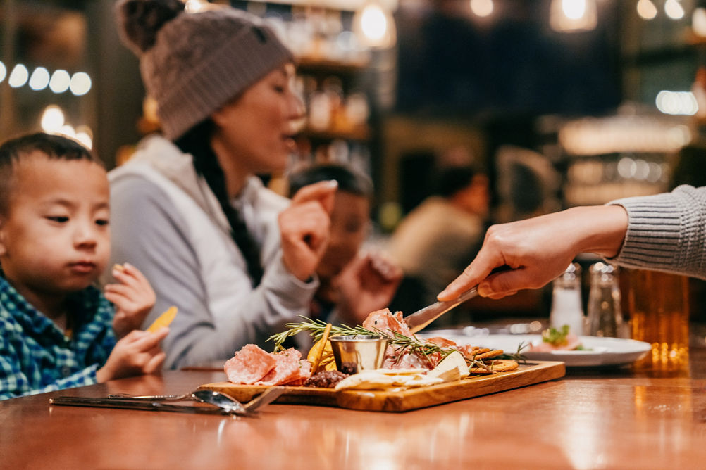 Family Enjoys Eating Appetizers at Wild Pine Restaurant at Northstar
