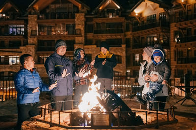 Family Warms Up from Firepit at Northstar