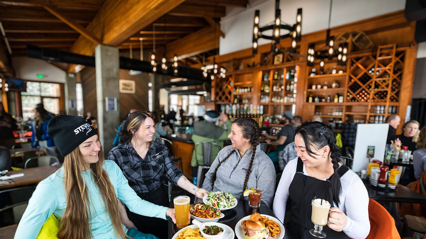 Four Friends Enjoy Lunch at Bullstooth at Stevens Pass