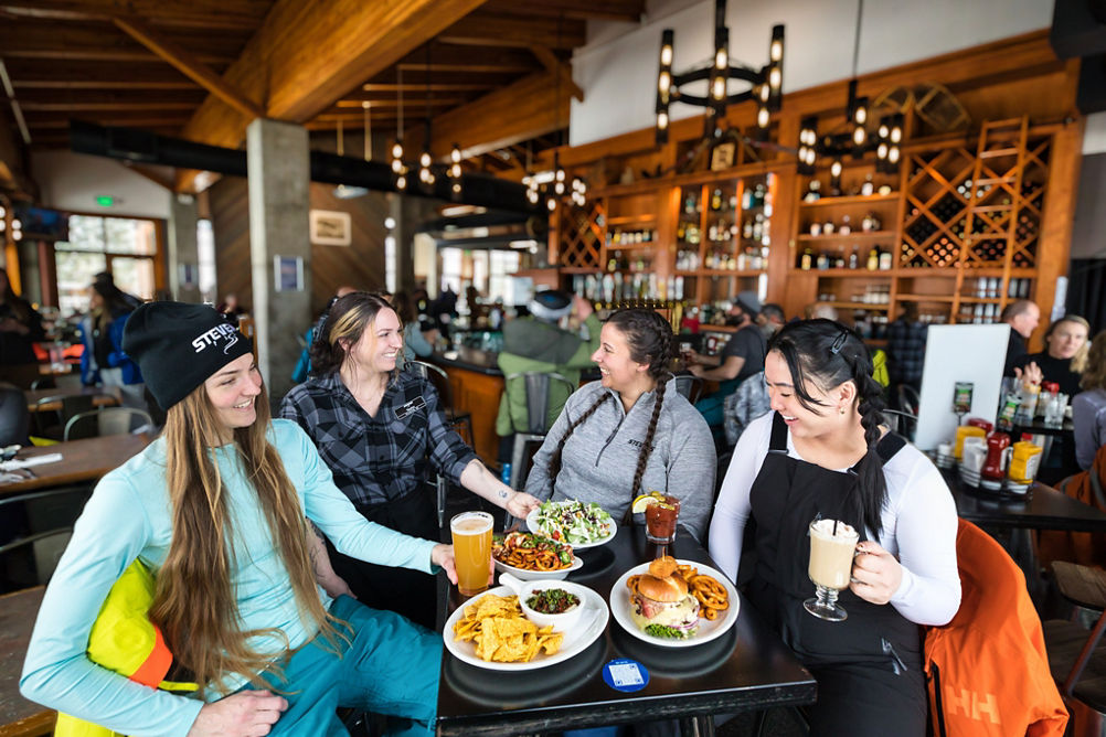 Four Friends Enjoy Lunch at Bullstooth at Stevens Pass