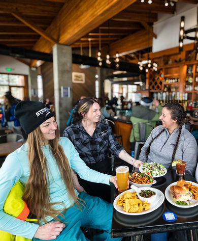 Four Friends Enjoy Lunch at Bullstooth at Stevens Pass