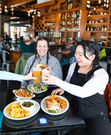 Four Friends Enjoy Lunch at Bullstooth at Stevens Pass