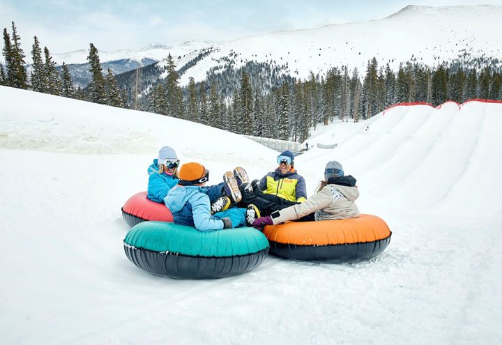 Family of Four Enjoys Tubing Together at Keystone