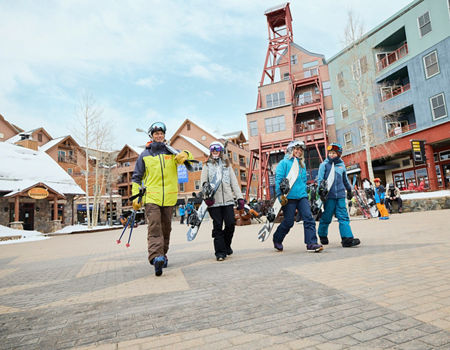 Family Walks Through the Keystone Resort Village with Their Gear