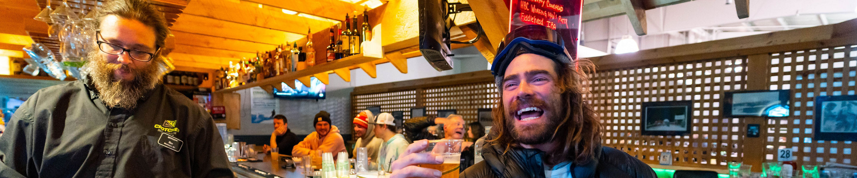 Man Smiling with a Beer at Onset Pub at Crotched