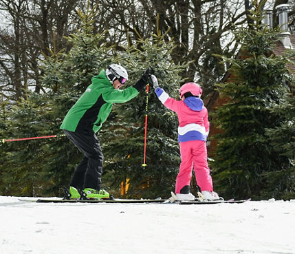 Child High Fives Skiing Instructor at Hidden Valley PA