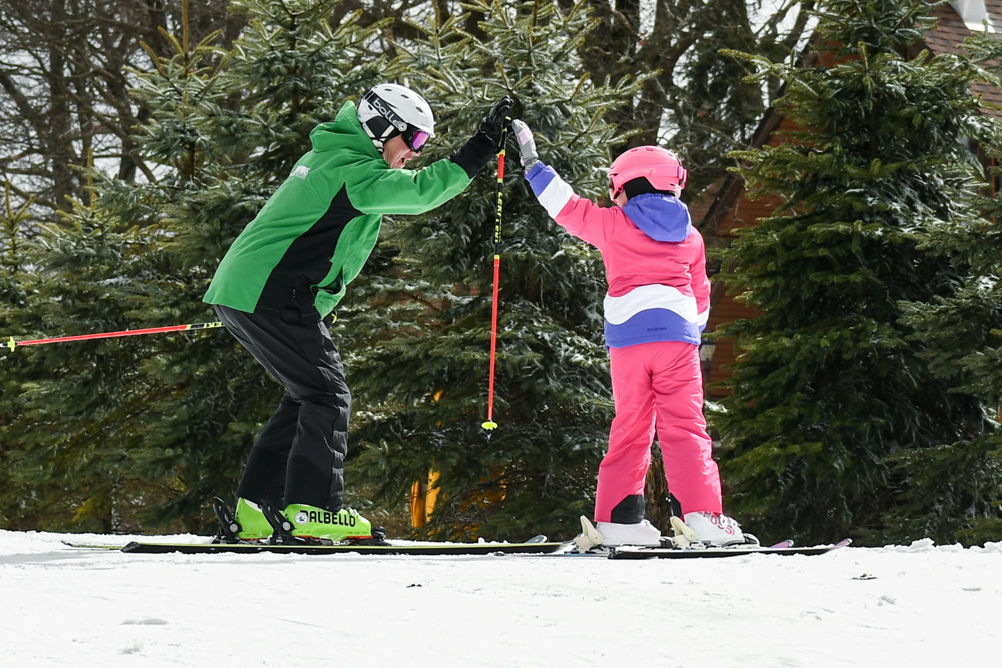 Child High Fives Skiing Instructor at Hidden Valley PA