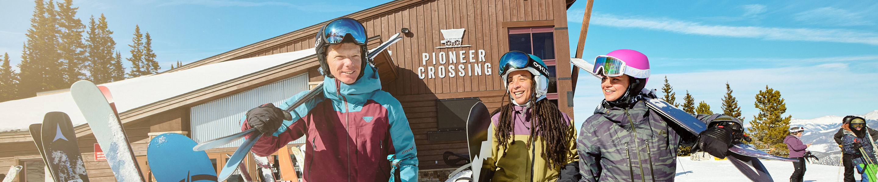 Friends Walking with Gear at Pioneer Crossing at Breckenridge