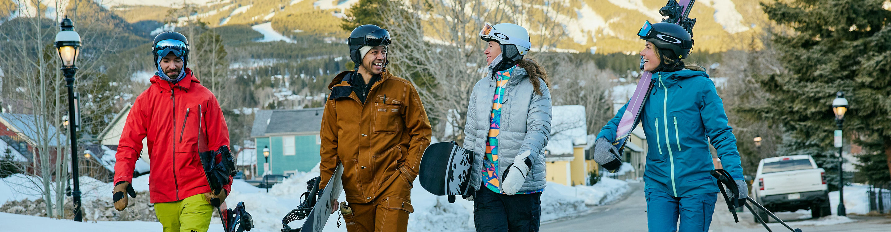 Group of Friends Walk Through the Town of Breckenridge with Gear