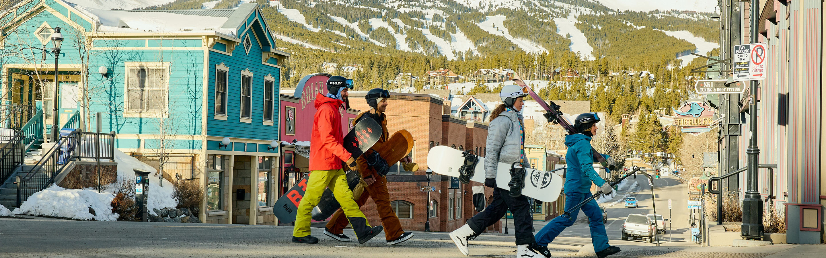 Group of Friends Walk Through the Town of Breckenridge with Gear