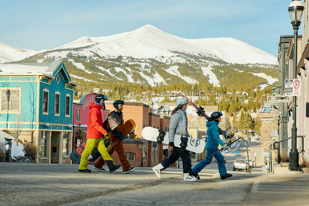Group of Friends Walk Through the Town of Breckenridge with Gear