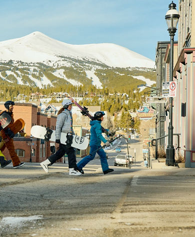 Group of Friends Walk Through the Town of Breckenridge with Gear