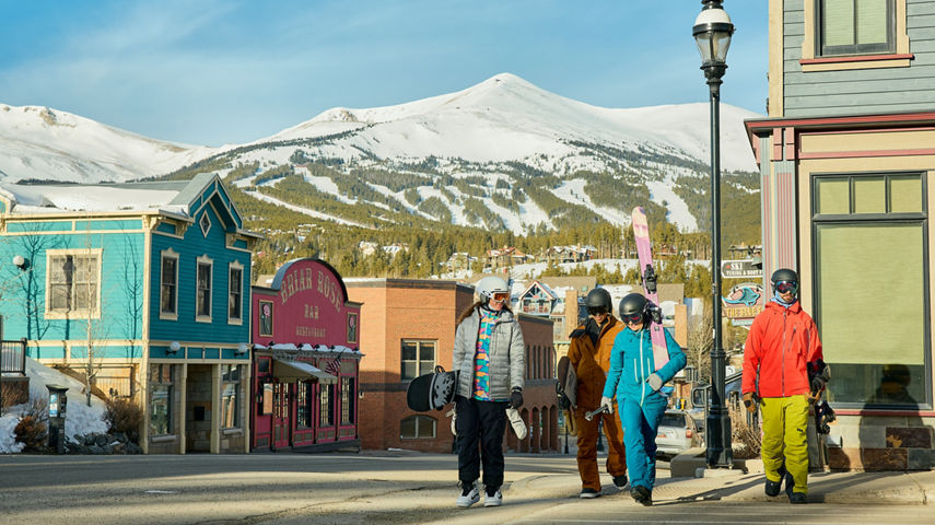 Group of Friends Walk Through the Town of Breckenridge with Gear