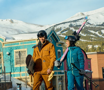 Group of Friends Walk Through the Town of Breckenridge with Gear
